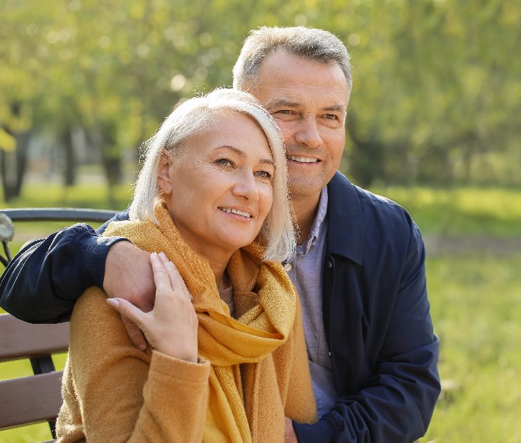 A senior couple of local residents on a park bench